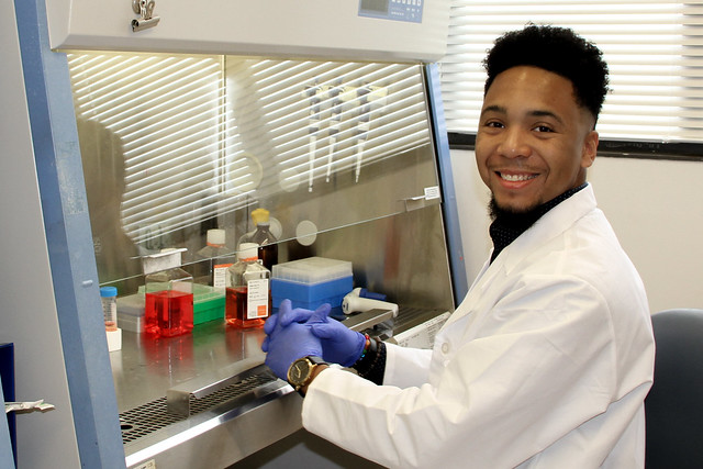 a student at a lab hood
