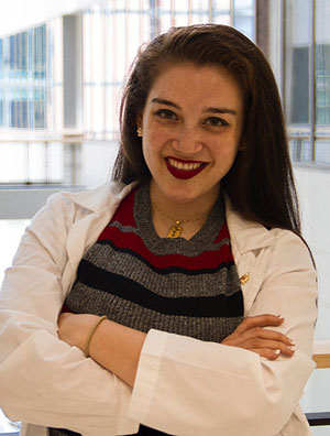 A student in their white medical coat